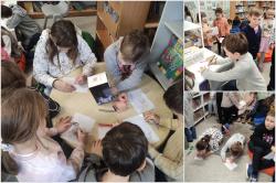 Dzień Kota - uczniowie podczas zajęć w bibliotece szkolnej.